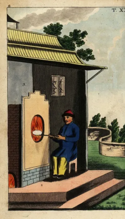 Framed Print : Chinese potter firing a porcelain plate in Framed Print : Chinese potter firing a porcelain plate in