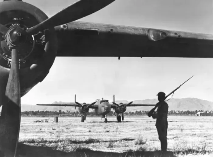 Framed Print : Chinese sentry guards American bomber Framed Print : Chinese sentry guards American bomber