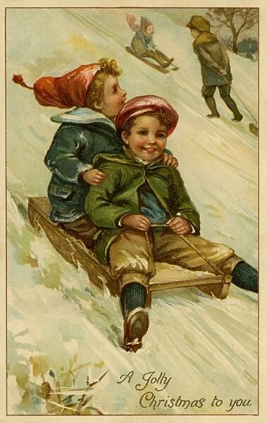 Christmas. 2 boys on a sledge
