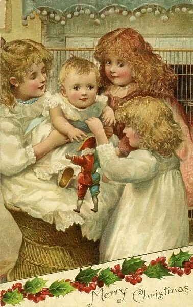 Christmas. 3 girls with a baby and a harlequin doll