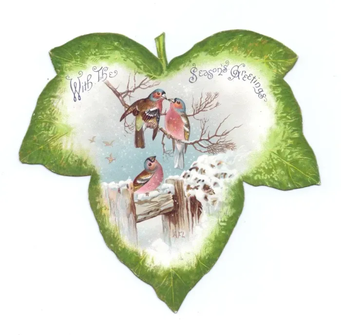 Framed Print : Christmas card in the shape of a green leaf with birds Framed Print : Christmas card in the shape of a green leaf with birds
