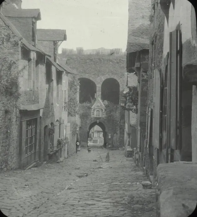 Framed Print : Dinan - black and white view of cobbled street, houses on both sides Date: circa 1890s Framed Print : Dinan - black and white view of cobbled street, houses on both sides Date: circa 1890s