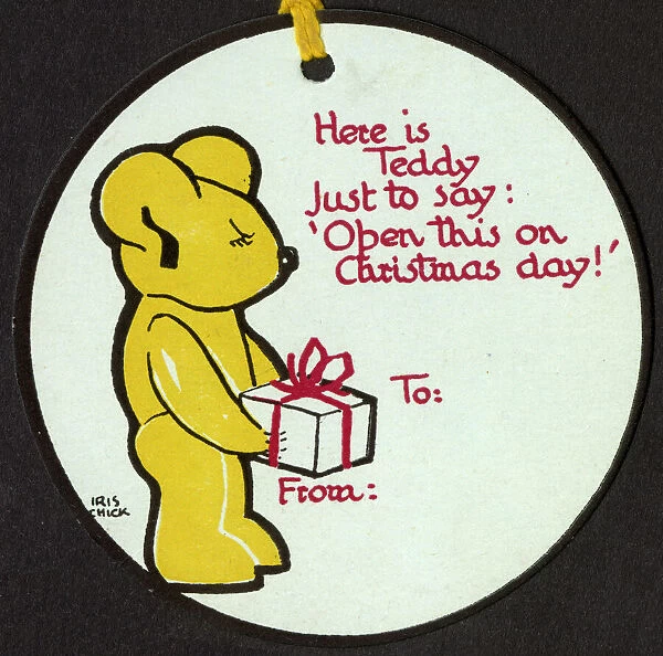 Circular Christmas gift tag featuring a teddy bear