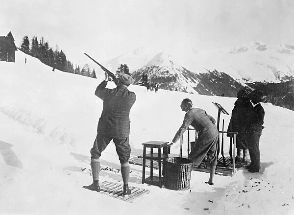 Clay Pigeon Shoot. A well-to-do shooting party, aiming at clay pigeons in the snow