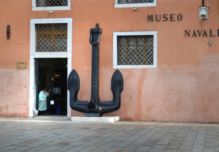 Framed Print : Cleaner mops the entrance of the Naval Museum, Venice Framed Print : Cleaner mops the entrance of the Naval Museum, Venice