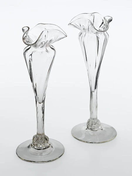Vases. One of two clear glass vases with a spreading foot