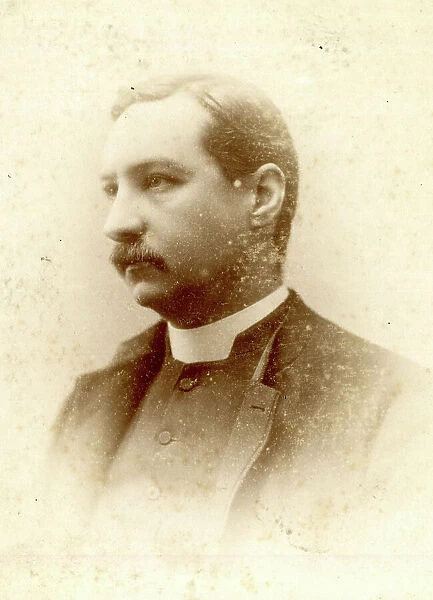 Clergyman in cabinet photograph