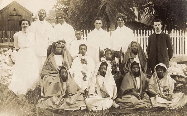 Clergyman and wife with African group