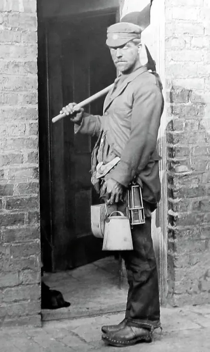 Framed Print : A coal miner arrives home after a shift