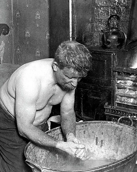 Coal miner washing at home