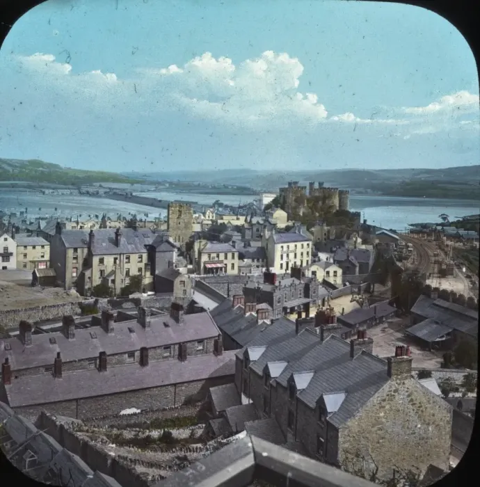 Framed Print : Conwy. Colour lantern slide featuring image looking over many buildings Framed Print : Conwy. Colour lantern slide featuring image looking over many buildings