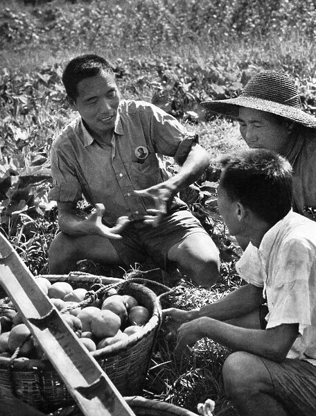 Communist China - farm workers in discussion
