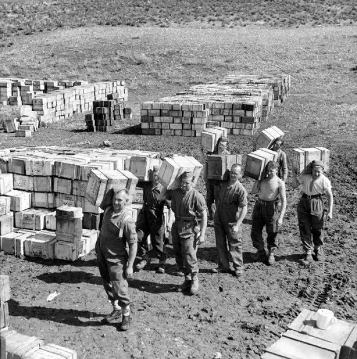 Framed Print : Compo ration dump and men carrying more supplies Framed Print : Compo ration dump and men carrying more supplies