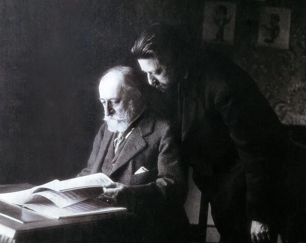 The composers Camille Saint-Sa%ns (seated) and Enrique Grana