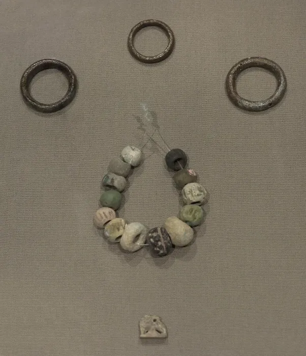Framed Print : Copper hair-rings and ring, beads and an amulet Framed Print : Copper hair-rings and ring, beads and an amulet