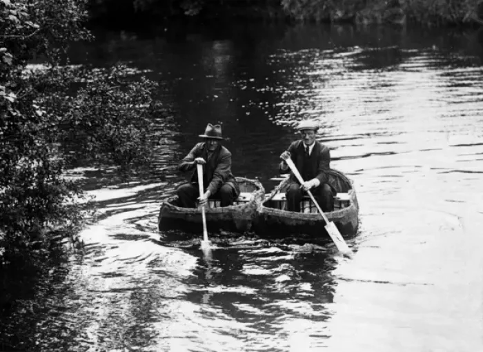 Framed Print : CORACLES. Two old men, paddling along a river in coracles. Date: 1930s Framed Print : CORACLES. Two old men, paddling along a river in coracles. Date: 1930s