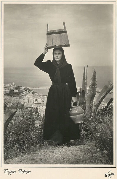 Corsica - Corsican woman with bucket on her head