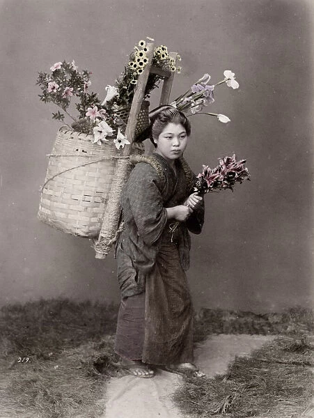 Country woman with basket of flowers, flower vendor, Japan