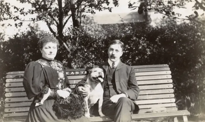 Framed Print : Couple on a bench with a dog Framed Print : Couple on a bench with a dog