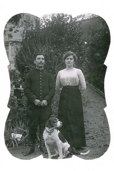 Couple with a dog in a garden, Lyons, France