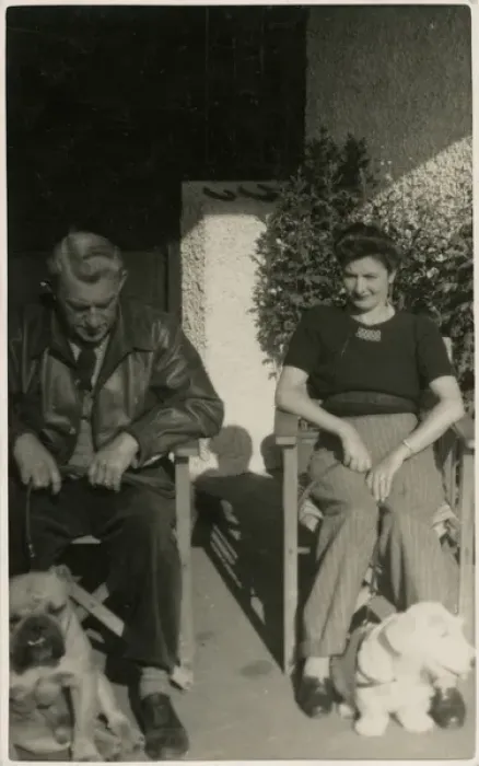 Framed Print : Couple in garden chairs with two dogs Framed Print : Couple in garden chairs with two dogs