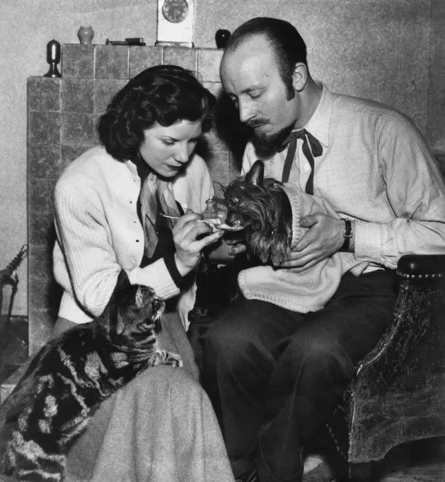 Framed Print : Couple giving medicine to a sick dog Framed Print : Couple giving medicine to a sick dog