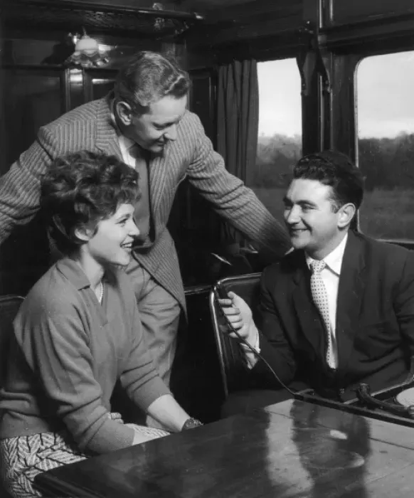 Framed Print : Couple are Interviewed on a Train Framed Print : Couple are Interviewed on a Train