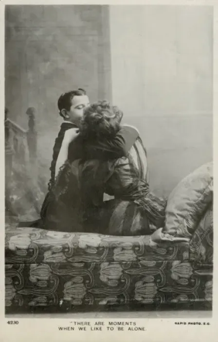 Framed Print : Couple kissing on a chaise longue Framed Print : Couple kissing on a chaise longue