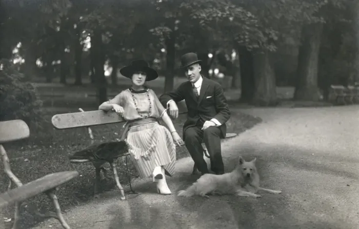 Framed Print : Couple in a park with a dog, France Framed Print : Couple in a park with a dog, France