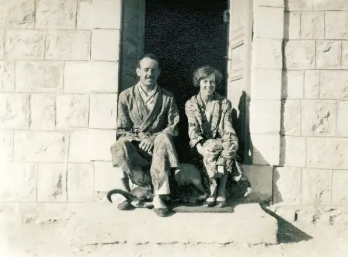 Framed Print : Couple in pyjamas sitting on a stone step in the sun Framed Print : Couple in pyjamas sitting on a stone step in the sun