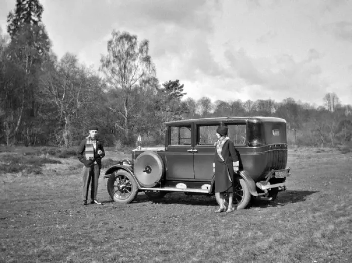 Framed Print : Couple relaxing by their car in a field Framed Print : Couple relaxing by their car in a field