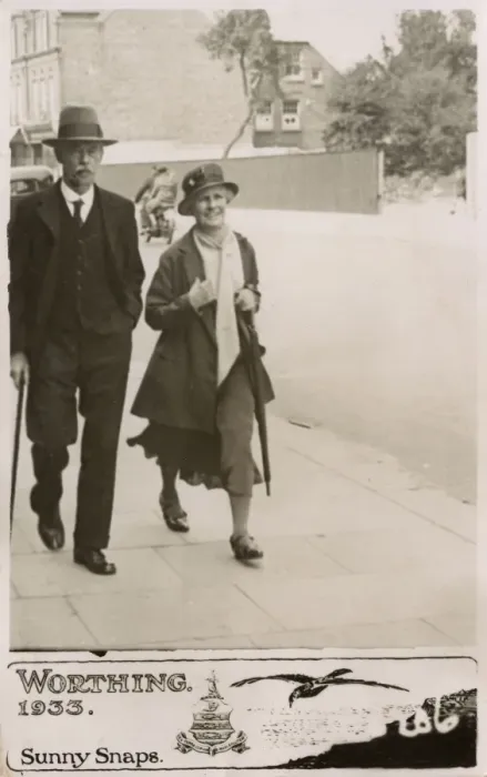 Framed Print : Couple strolling down a street in Worthing - Sunny Snaps Framed Print : Couple strolling down a street in Worthing - Sunny Snaps