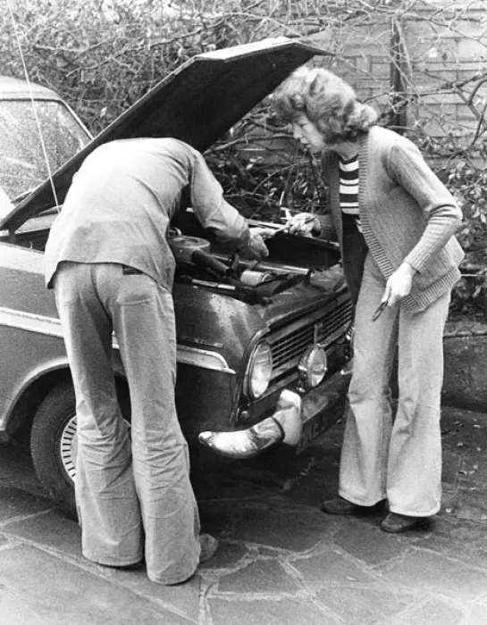 Framed Print : Couple trying to fix a car on a London street Framed Print : Couple trying to fix a car on a London street