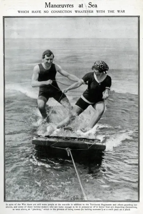 Framed Print : Couple water-planing on a wooden raft Framed Print : Couple water-planing on a wooden raft