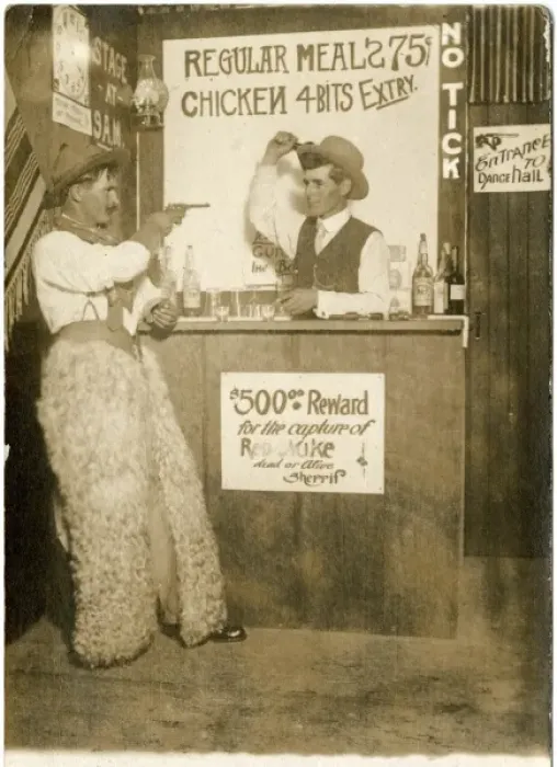 Framed Print : Cowboy holding up a bartender in a bar Framed Print : Cowboy holding up a bartender in a bar