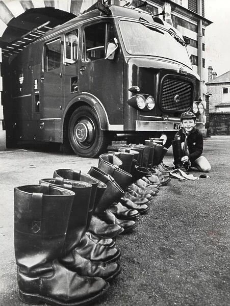 Cub Scout cleaning firemens boots, Surrey