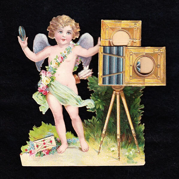 Cupid with a camera on a cutout greetings card