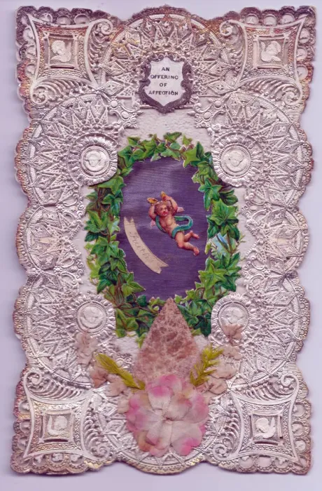 Framed Print : Cupid with ivy leaves on a paper lace romantic card Framed Print : Cupid with ivy leaves on a paper lace romantic card