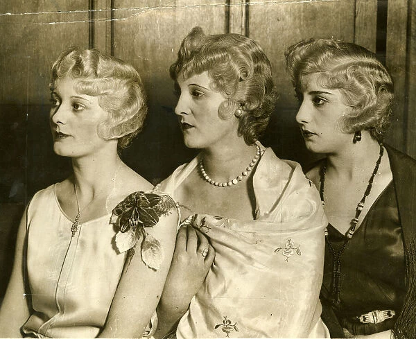 Curled hair in typical coiffures of 1930