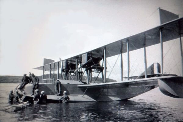 Curtiss H-16 (forward view) at mooring with crewmen