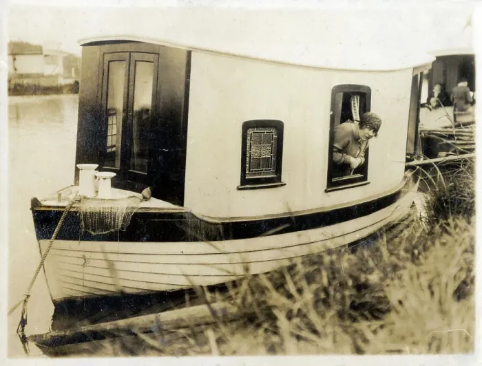 Framed Print : Cute, miniature Houseboat and occupant Framed Print : Cute, miniature Houseboat and occupant