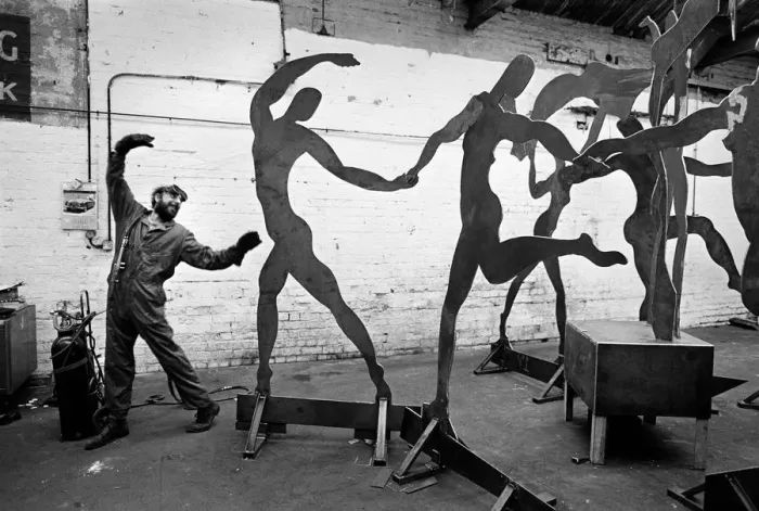 Framed Print : Dancing welder with sculpture Framed Print : Dancing welder with sculpture