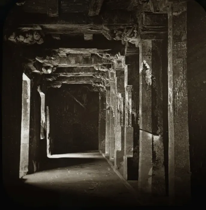 Framed Print : A dark corridor with many carved columns on each side Framed Print : A dark corridor with many carved columns on each side
