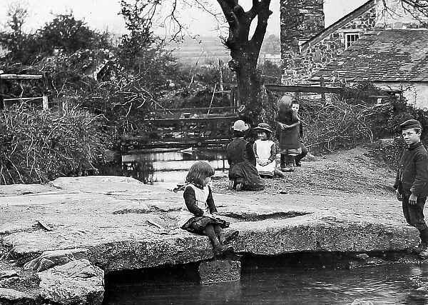 Dartmoor Children playing on stone bridge early 1900s