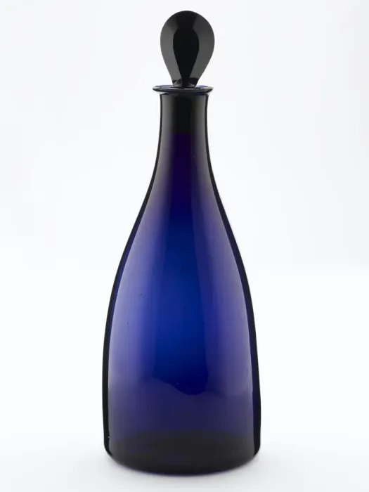 Framed Print : Decanter of tapered form made from blown and bevelled blue glass Framed Print : Decanter of tapered form made from blown and bevelled blue glass