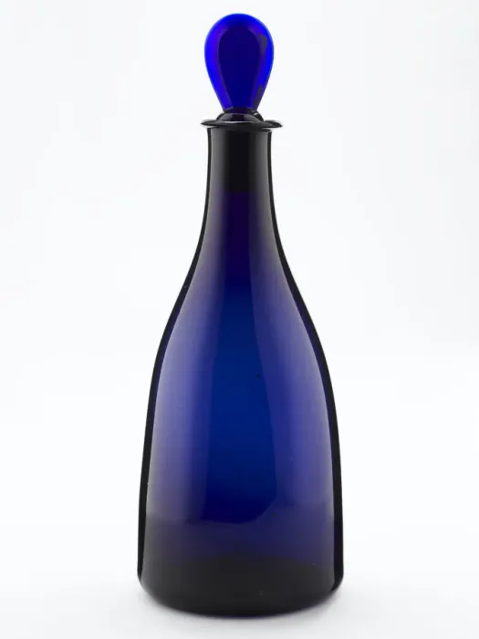 Framed Print : Decanter of tapered form made from blown and bevelled blue glass Framed Print : Decanter of tapered form made from blown and bevelled blue glass