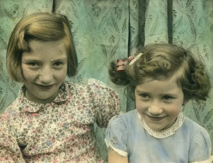 Framed Print : Delightful colour photograph of two little girls, possibly sisters, seated together Framed Print : Delightful colour photograph of two little girls, possibly sisters, seated together