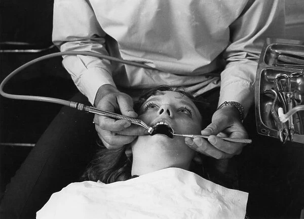 Dentist operates on patient