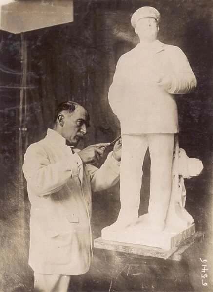 Denys Geuch with statue of Edward VII