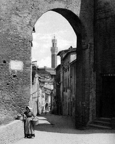 Via di Sant Agata and Torre del Mangia, Siena, Italy